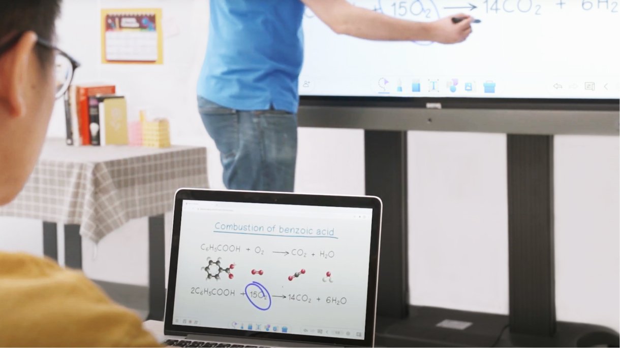Student seeing whiteboard on laptop in realtime while teacher writes on the BenQ Board interactive display