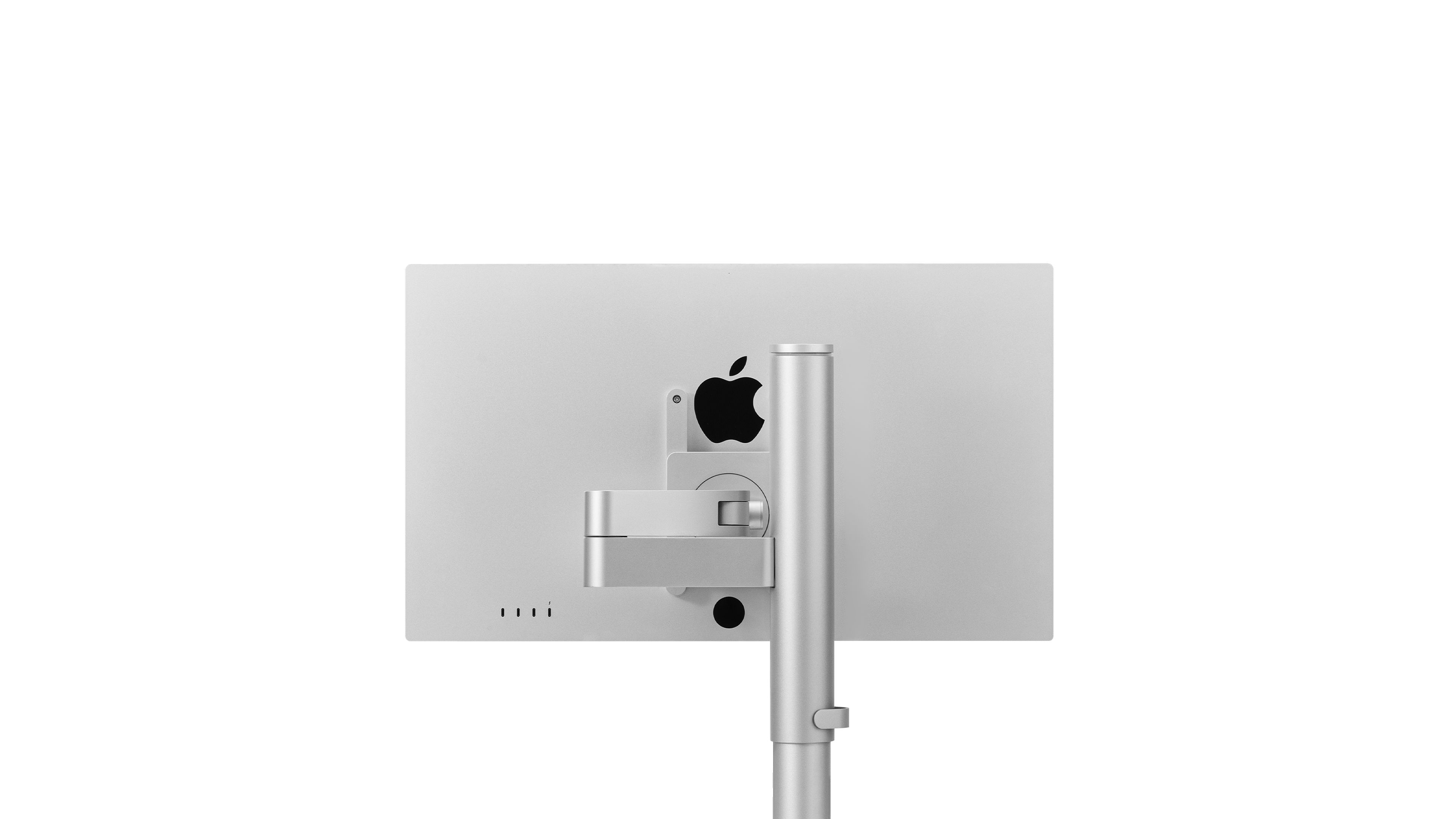 A studio display mounted on a studio arm, demonstrating ergonomic monitor positioning for Apple workspace.