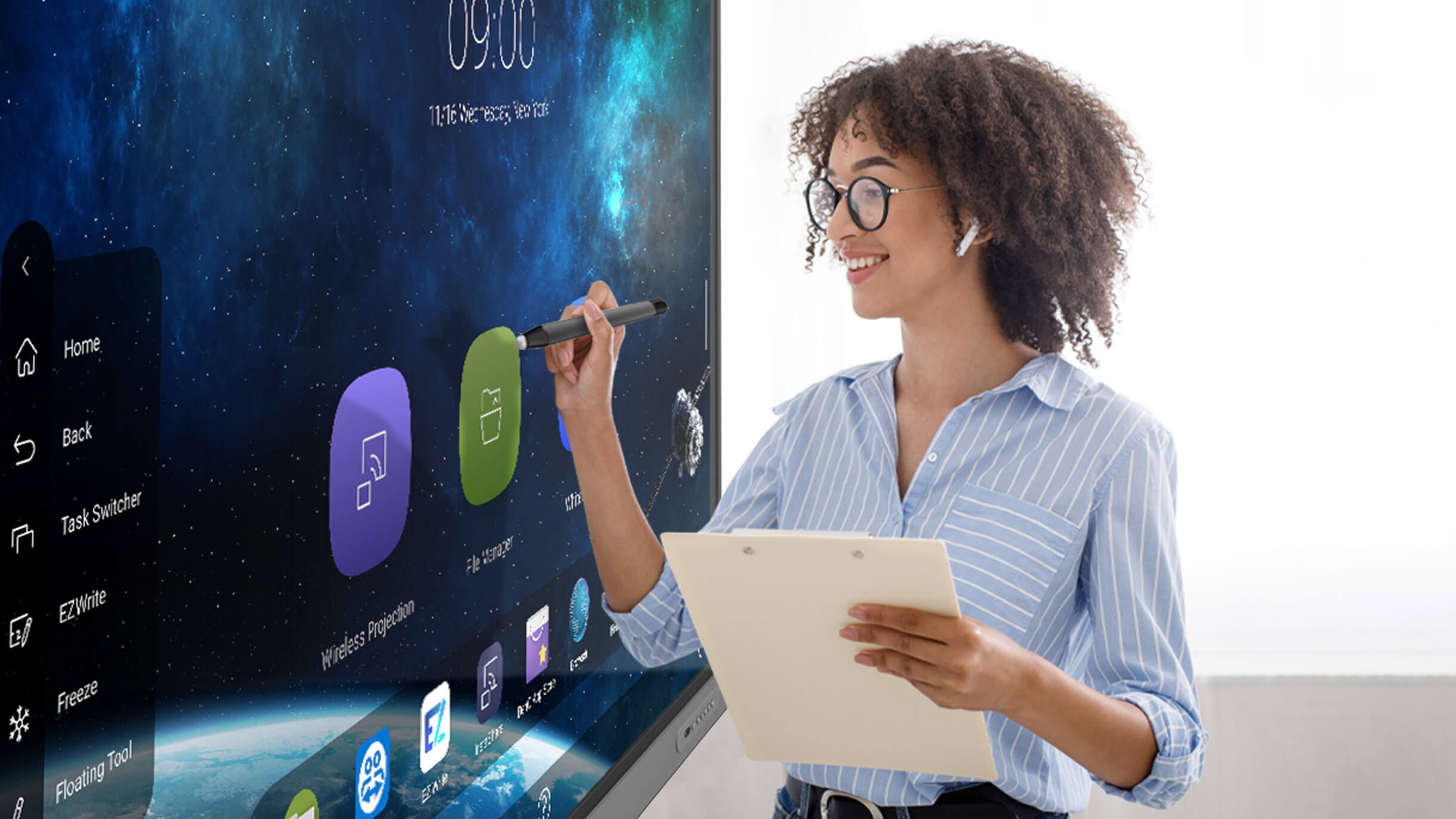 Teacher writing on a BenQ Board interactive display wearing earphones