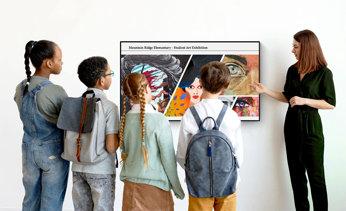 Teacher showing students an art exhibition on a BenQ display using digital signage software