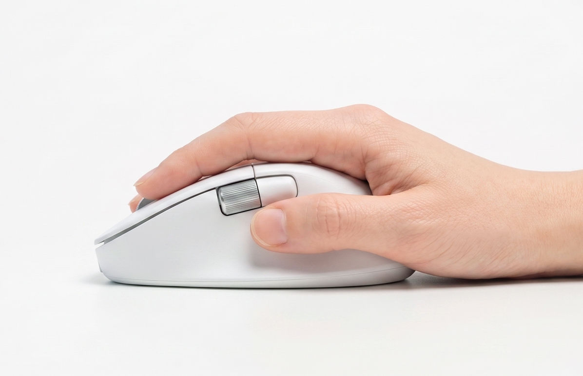 Hand resting on INFTYLAB M Mouse, showing its ergonomic shape designed to fit naturally in the hand.