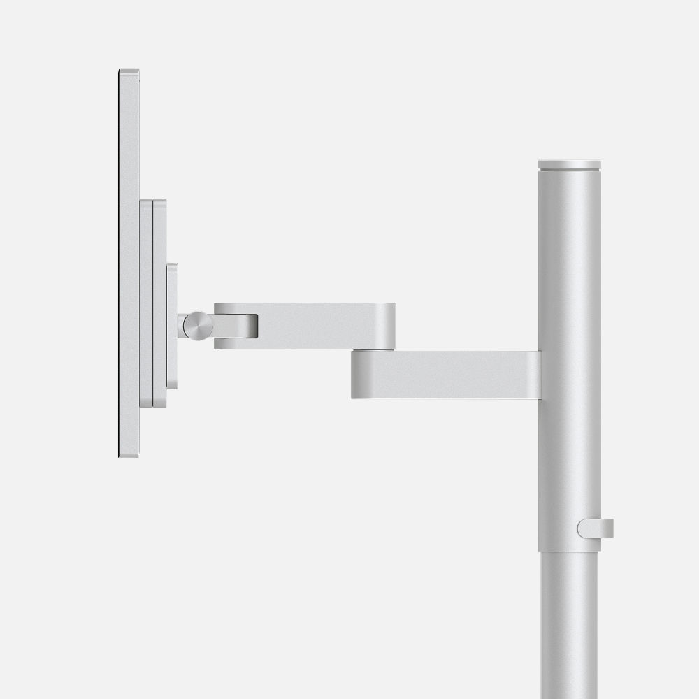 Studio Arm monitor mount shown from the side, displaying the aluminum arm joints and counterbalancing mechanism with precision engineering details.