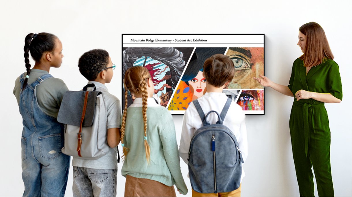 Teacher showing students an art exhibition on a BenQ display using digital signage software