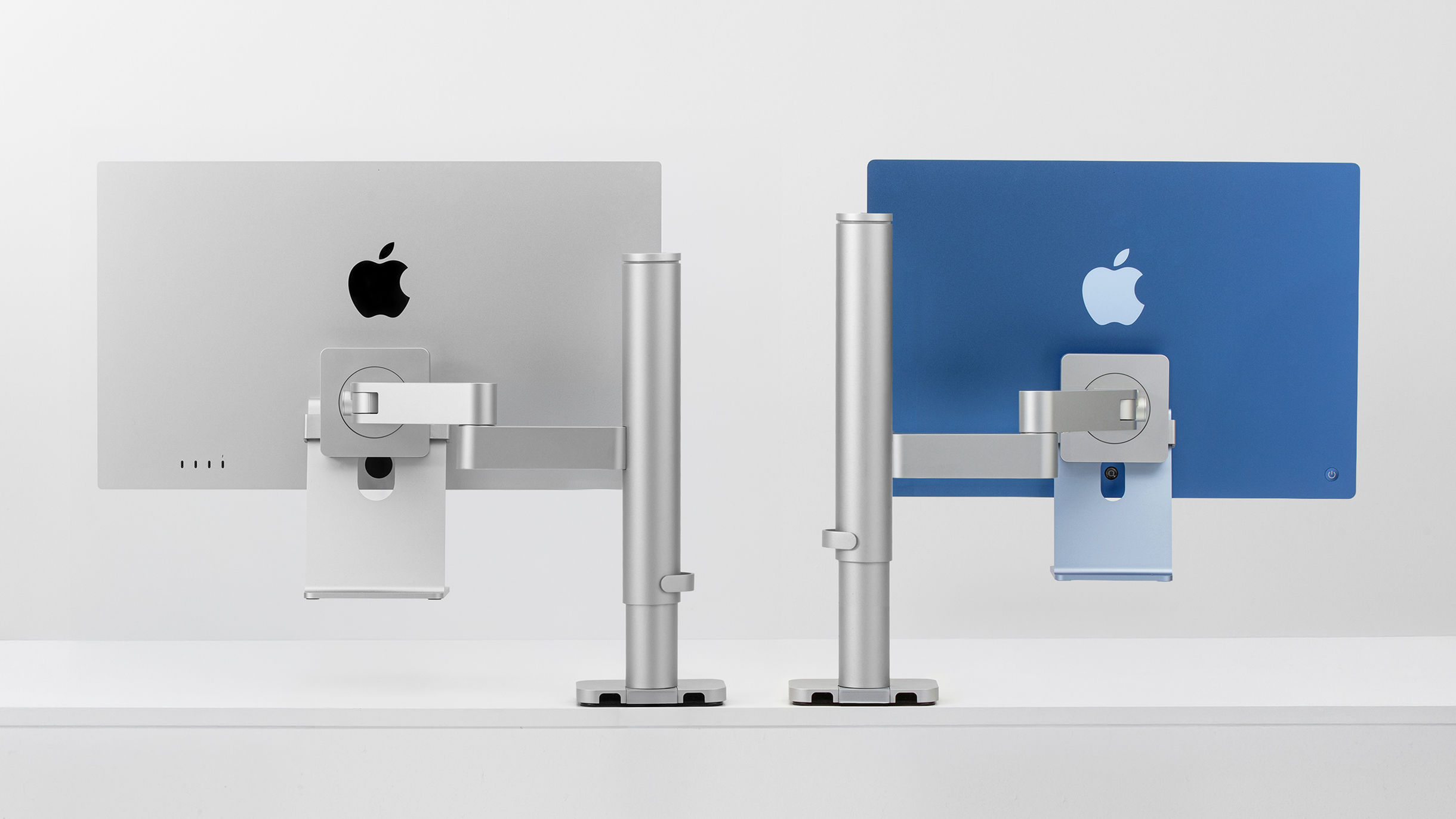 Back view of Studio Display and iMac mounted on Studio Arm via Stand Clip, showing compatibility with both displays.