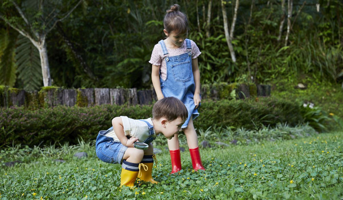 Two young kids playing outside