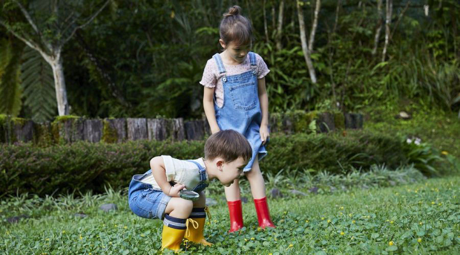 Two young kids playing outside