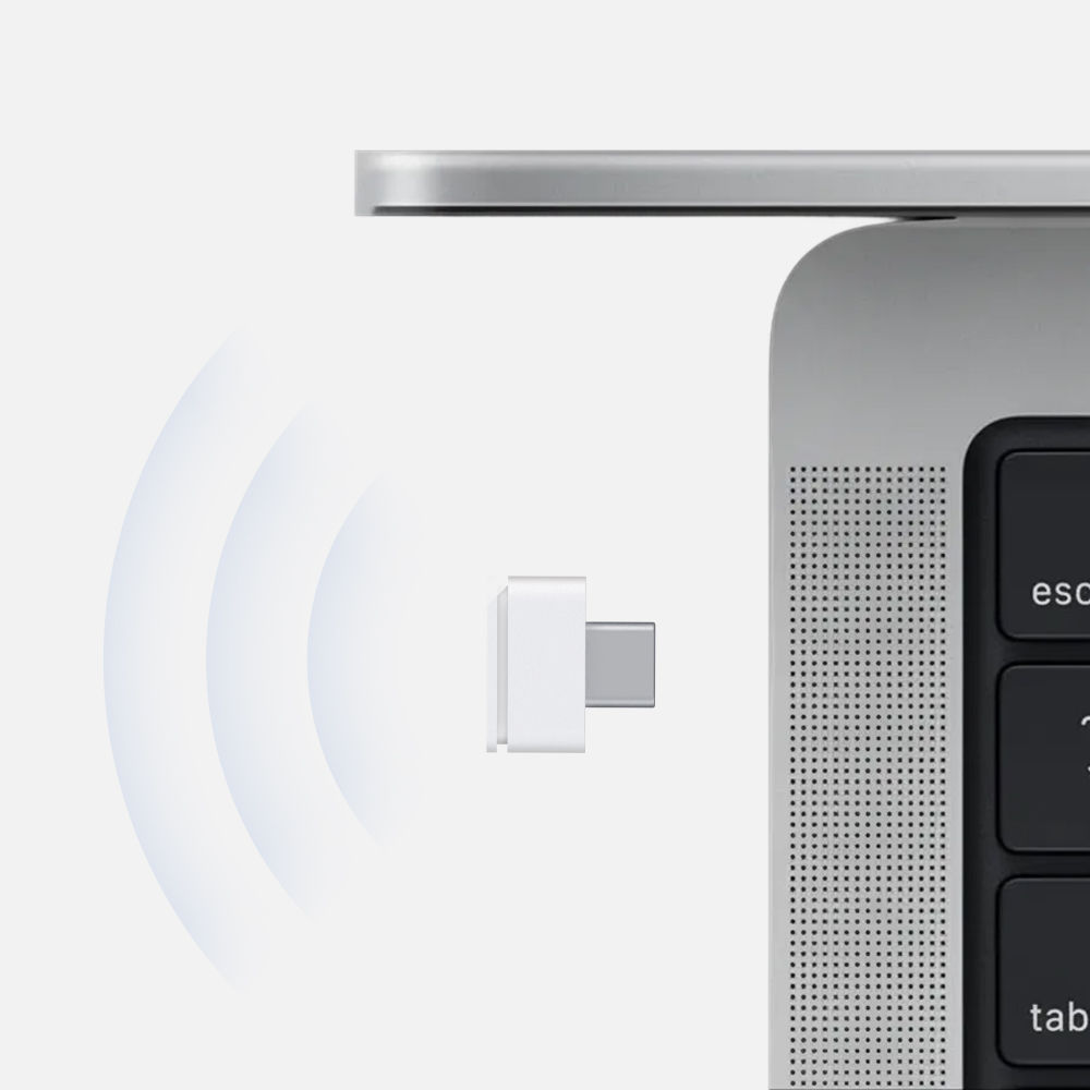 Compact 2.4G USB-C receiver shown beside a MacBook USB-C port for wireless mouse connection.