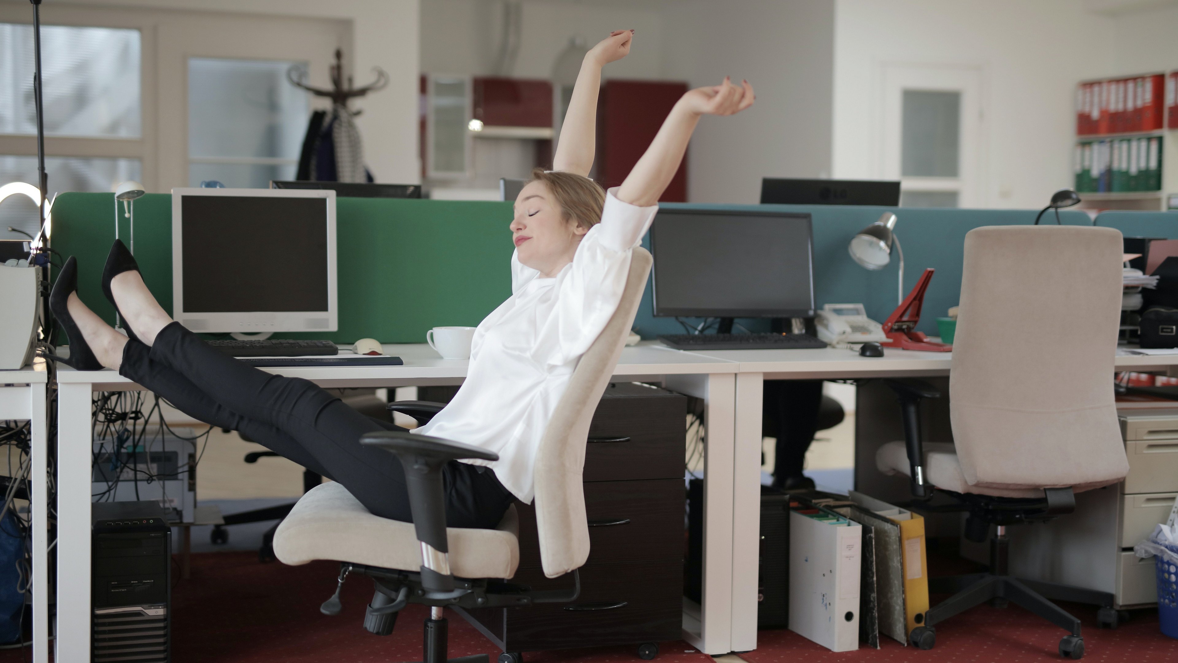 girl stretching in an office