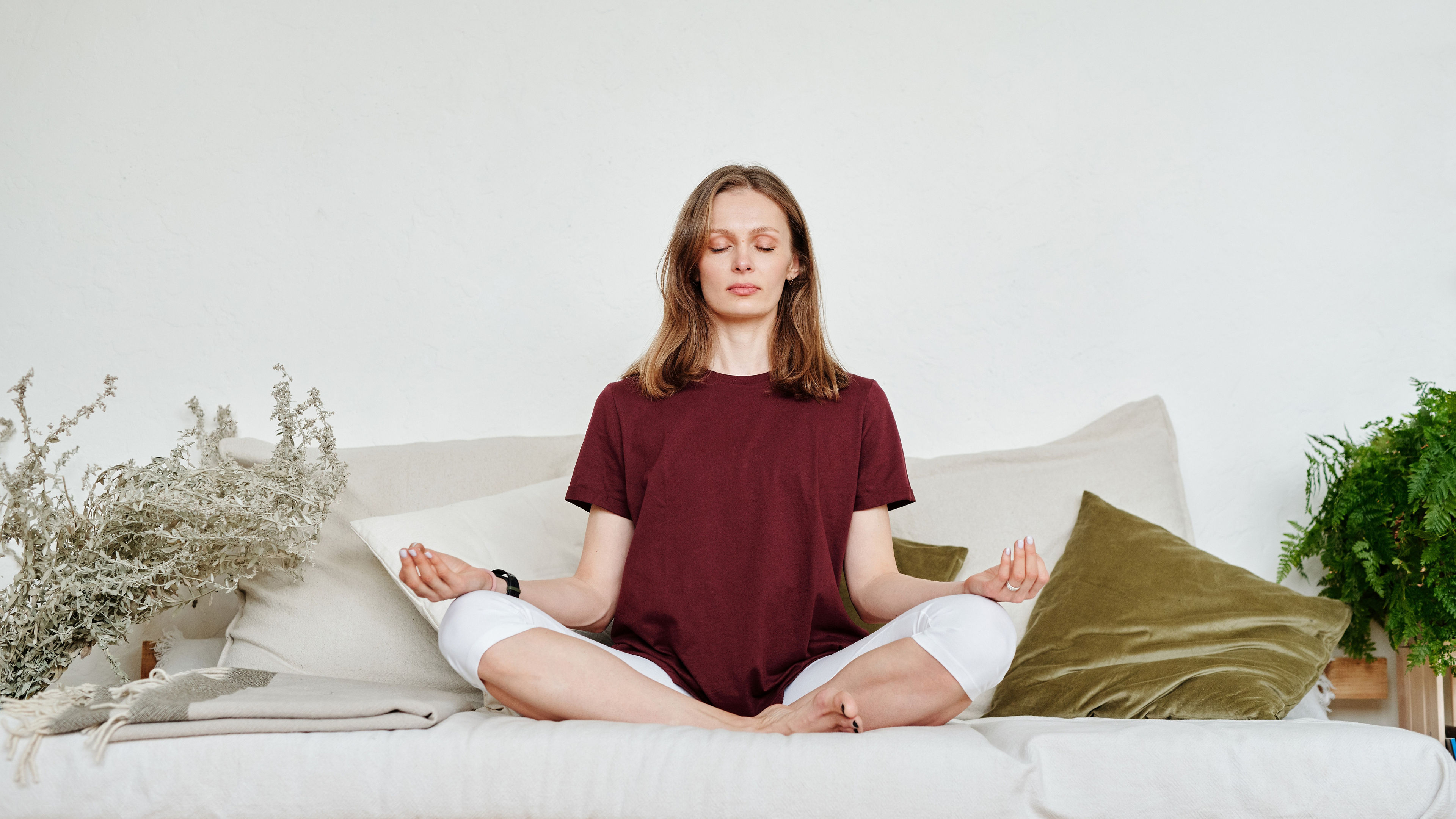 girl doing meditation on a white coach