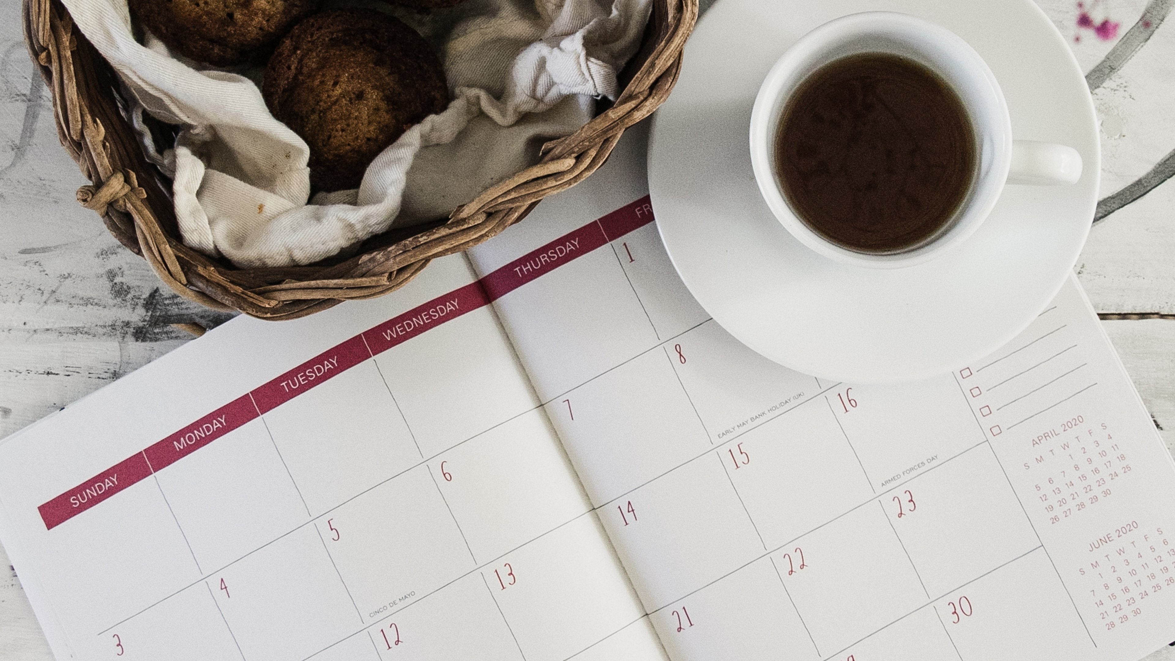 a calender with a cup of coffee