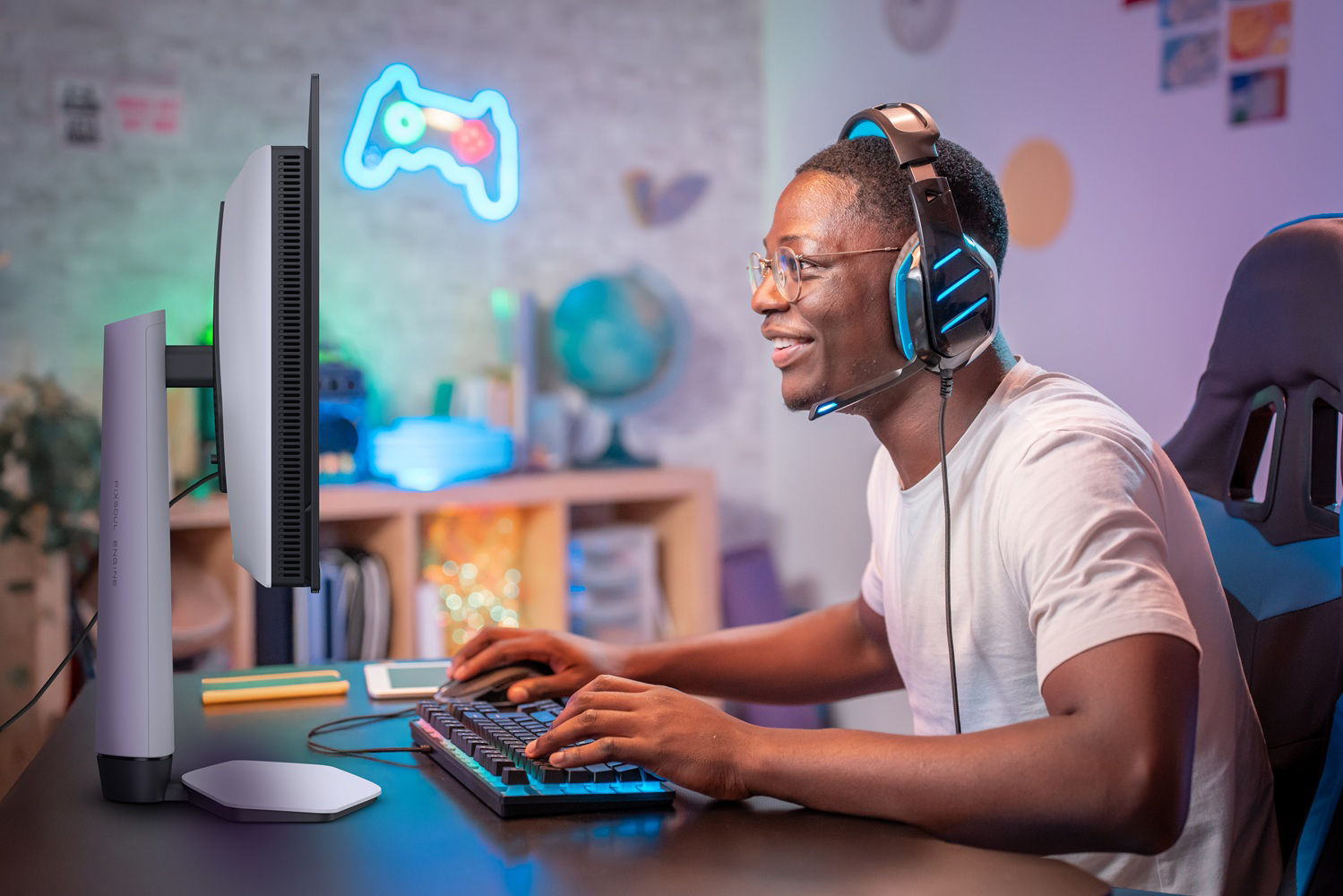 Streamer young man professional gamer play online games computer with headphones, colorful neon light room.