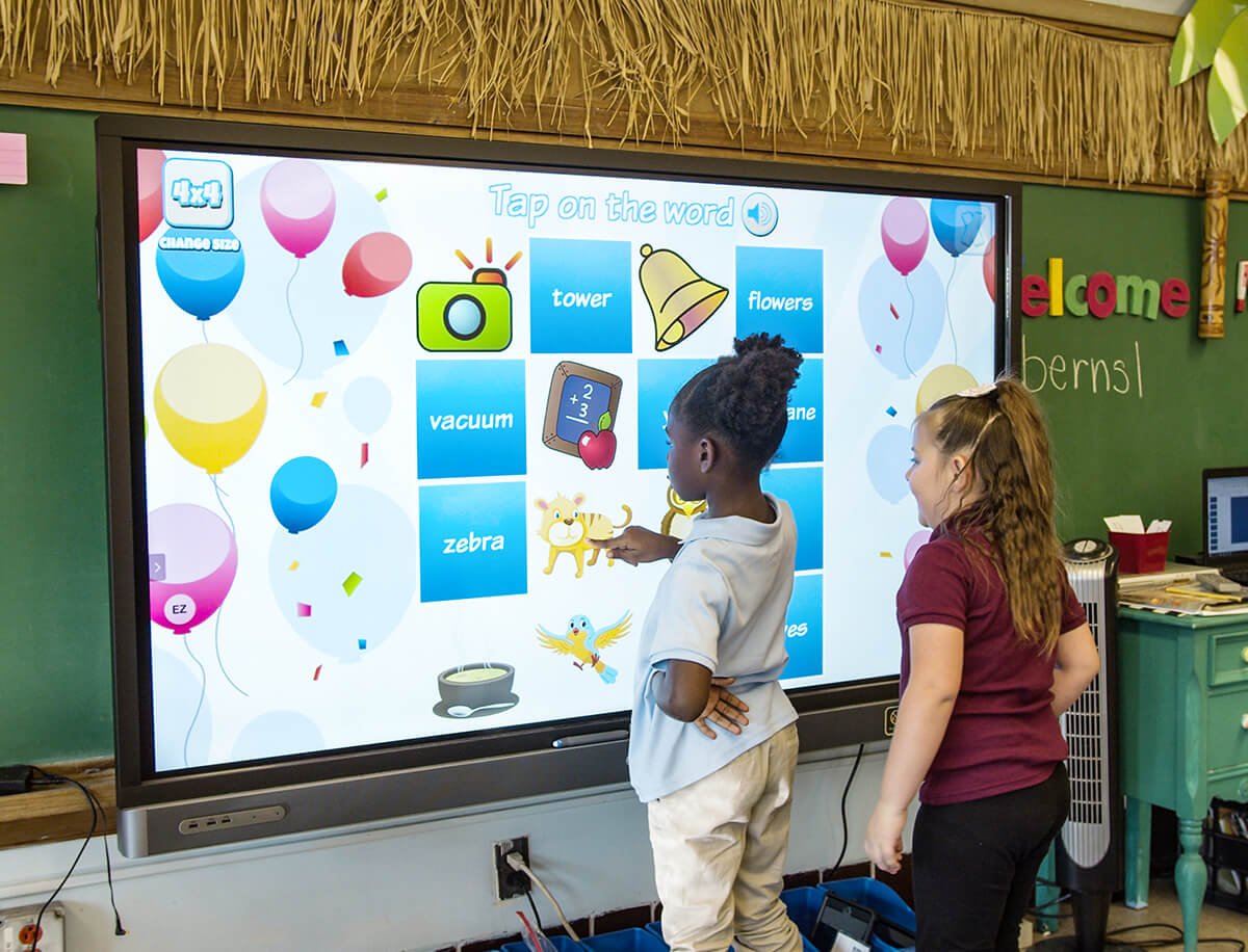 2 students of Kankakee School District playing vocabulary games in class on the classroom BenQ interactive board