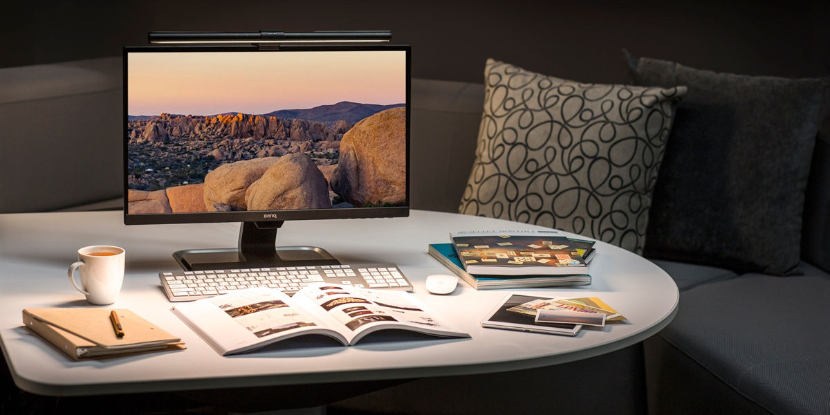 BenQ screenbar LED on a monitor with warm white light on a desk