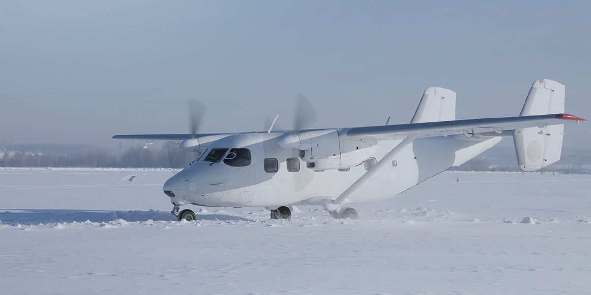 a white jet in the snow in the style of tv series on netflix black summer