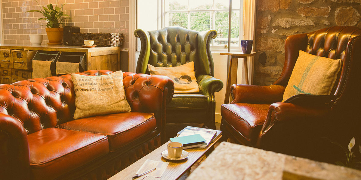 a living room with sofas in the style of TV series Friends