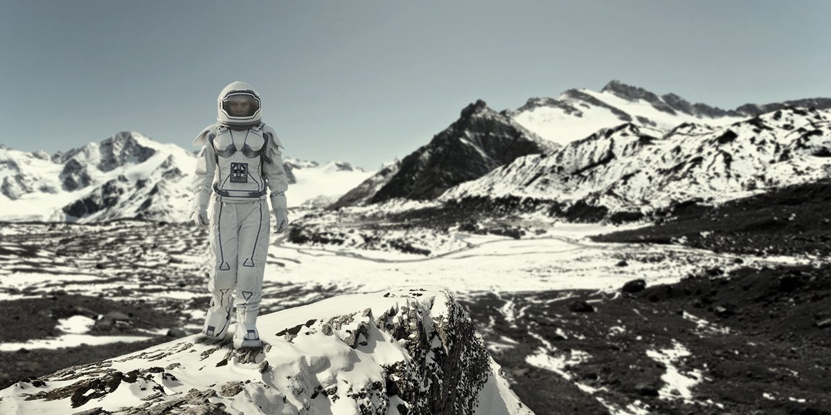 A spaceman walking on a planet in the style of Christopher Nolan's Interstellar