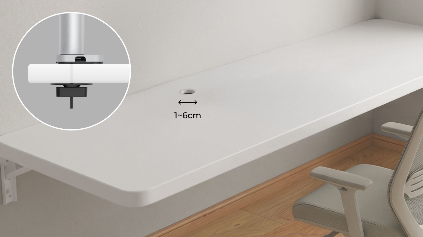 Illustration showing the minimum 1.2 cm desk hole diameter required to install a monitor arm grommet mount.
