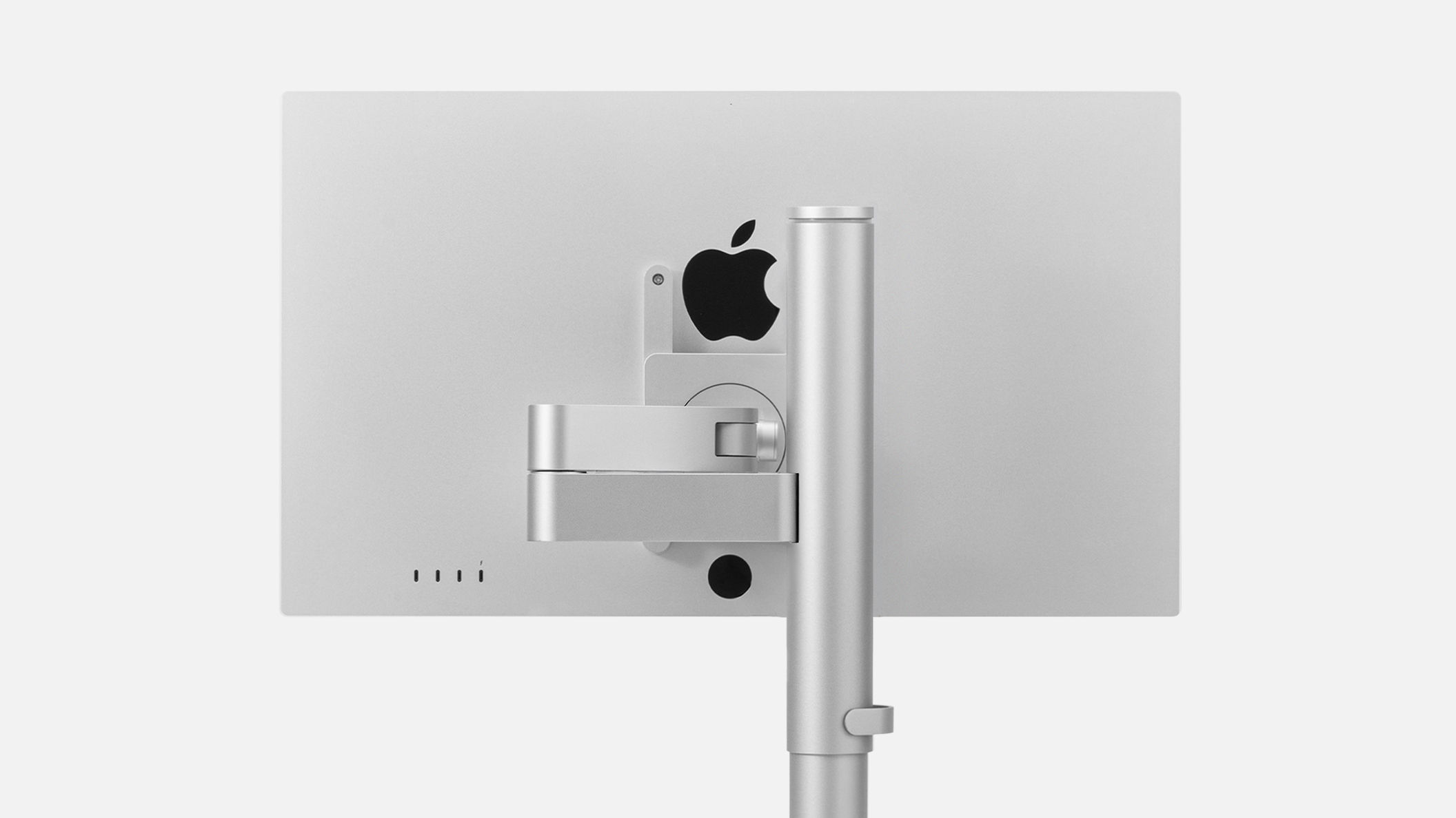 Rear view of an Apple Studio Display mounted on the INFTYLAB Studio Arm, showcasing its clean, minimalist design.