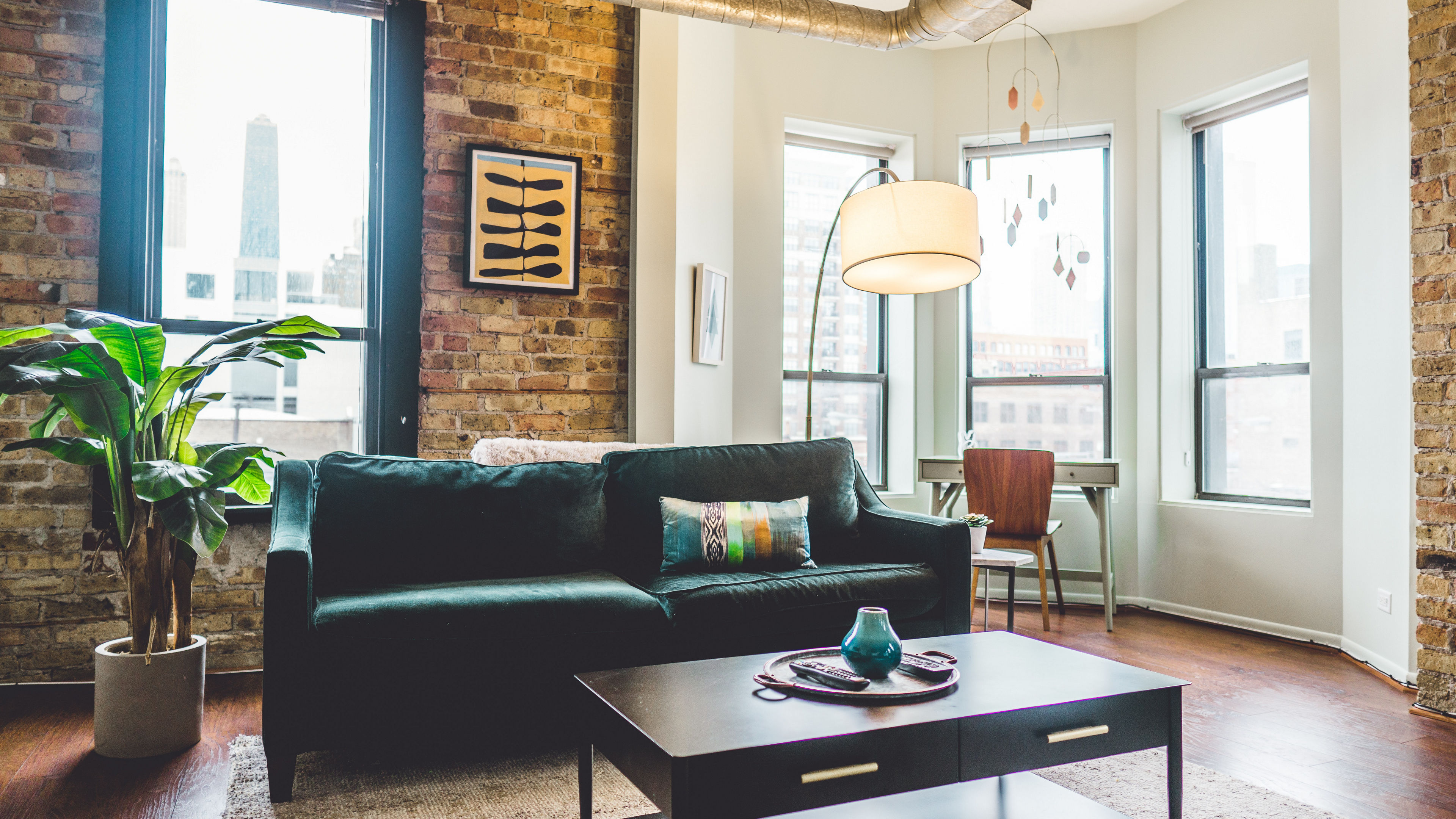 living room with large curved floor lamp