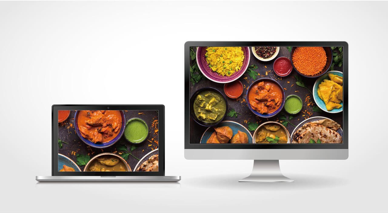 There are two different size monitors displaying food.