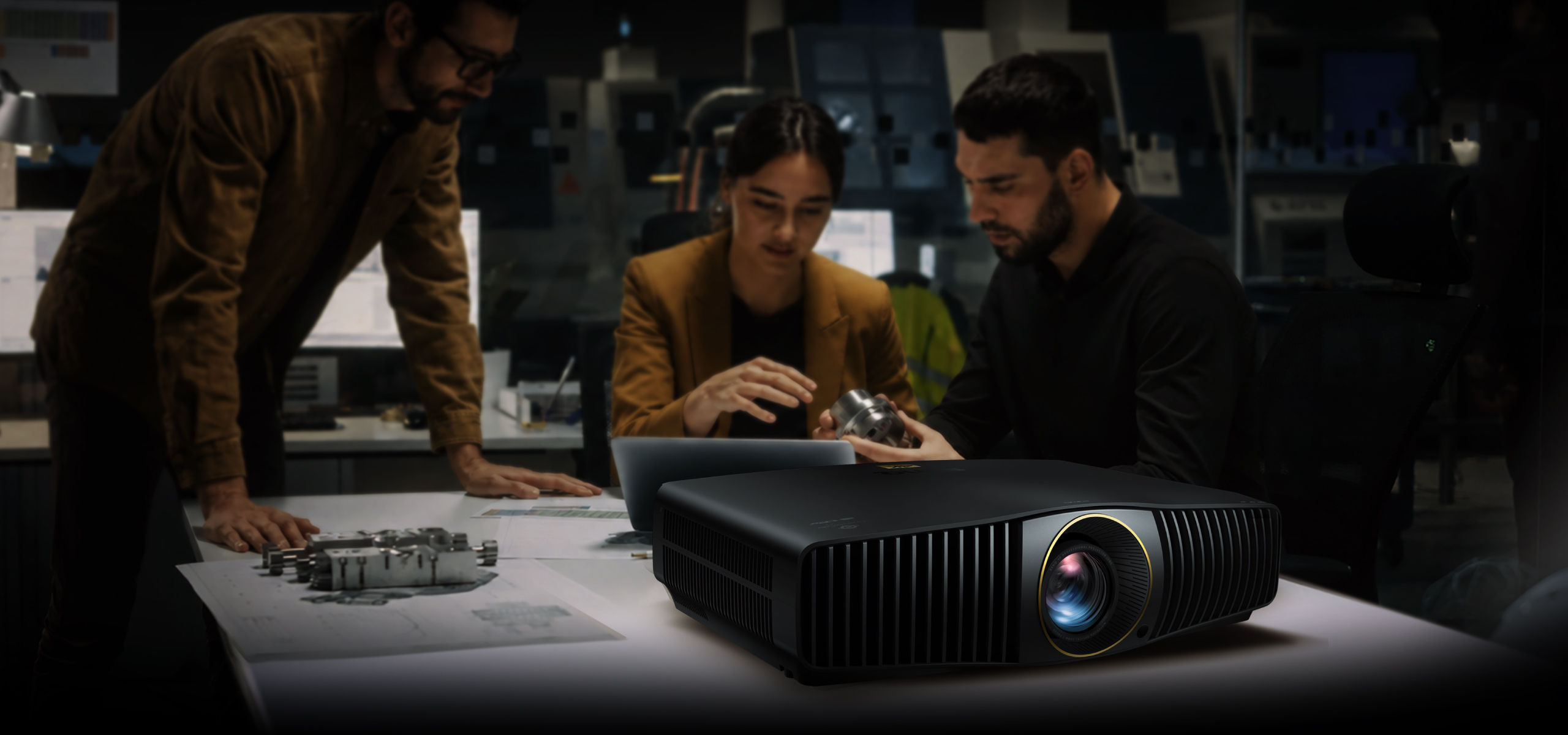 BenQ W Series home cinema projector with engineers performing color calibration and laboratory verification