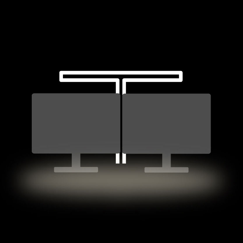 Wide desk illumination for dual monitor workspaces