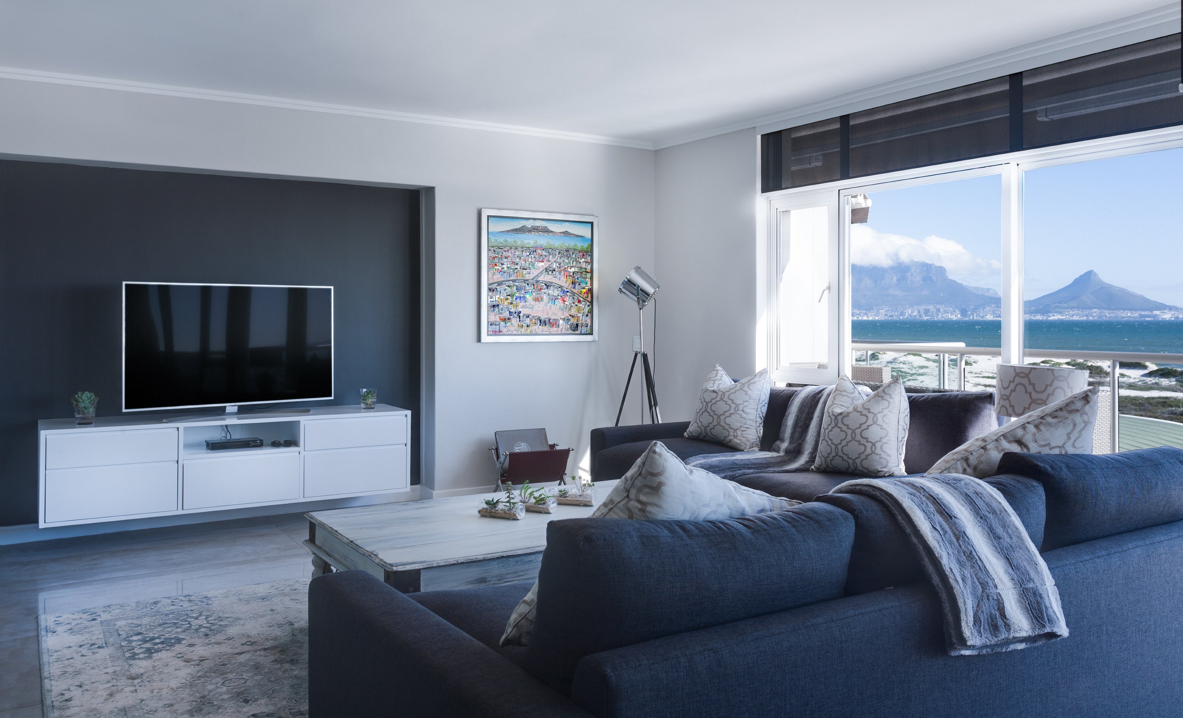 minimalist style living room with modern style floor lamp