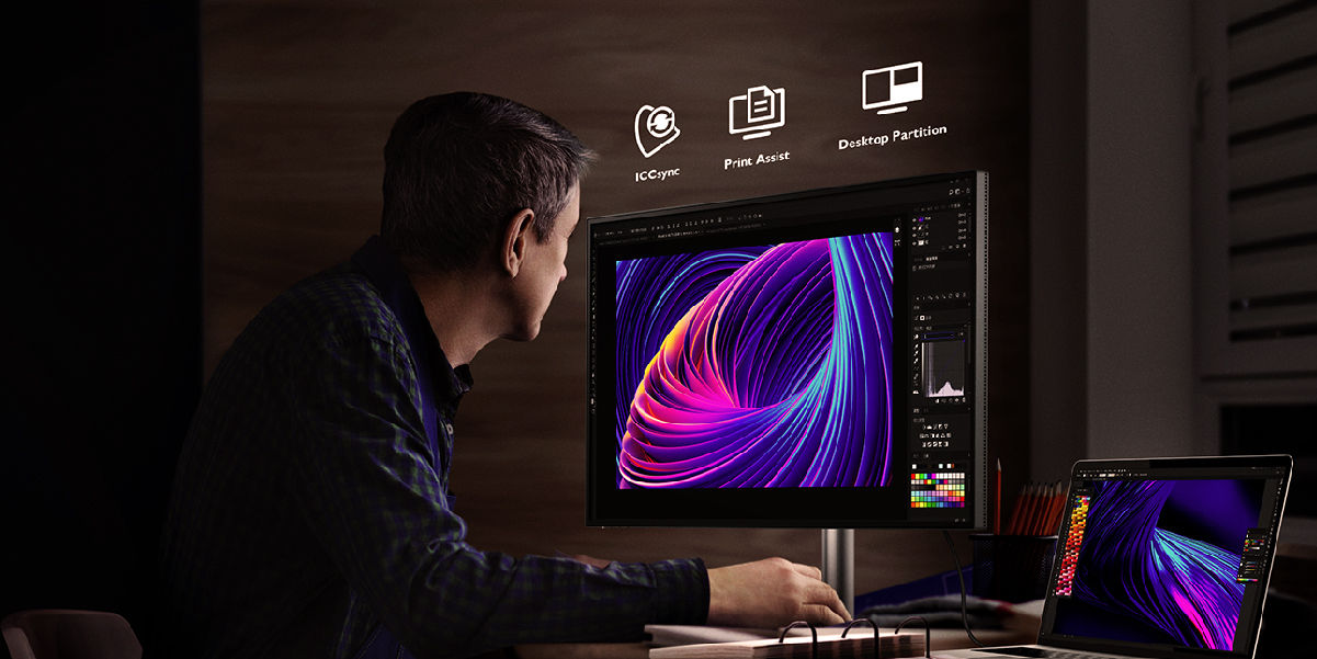 A man's using the BenQ monitor with ICCsync, print Assist, and Desktop Partition.