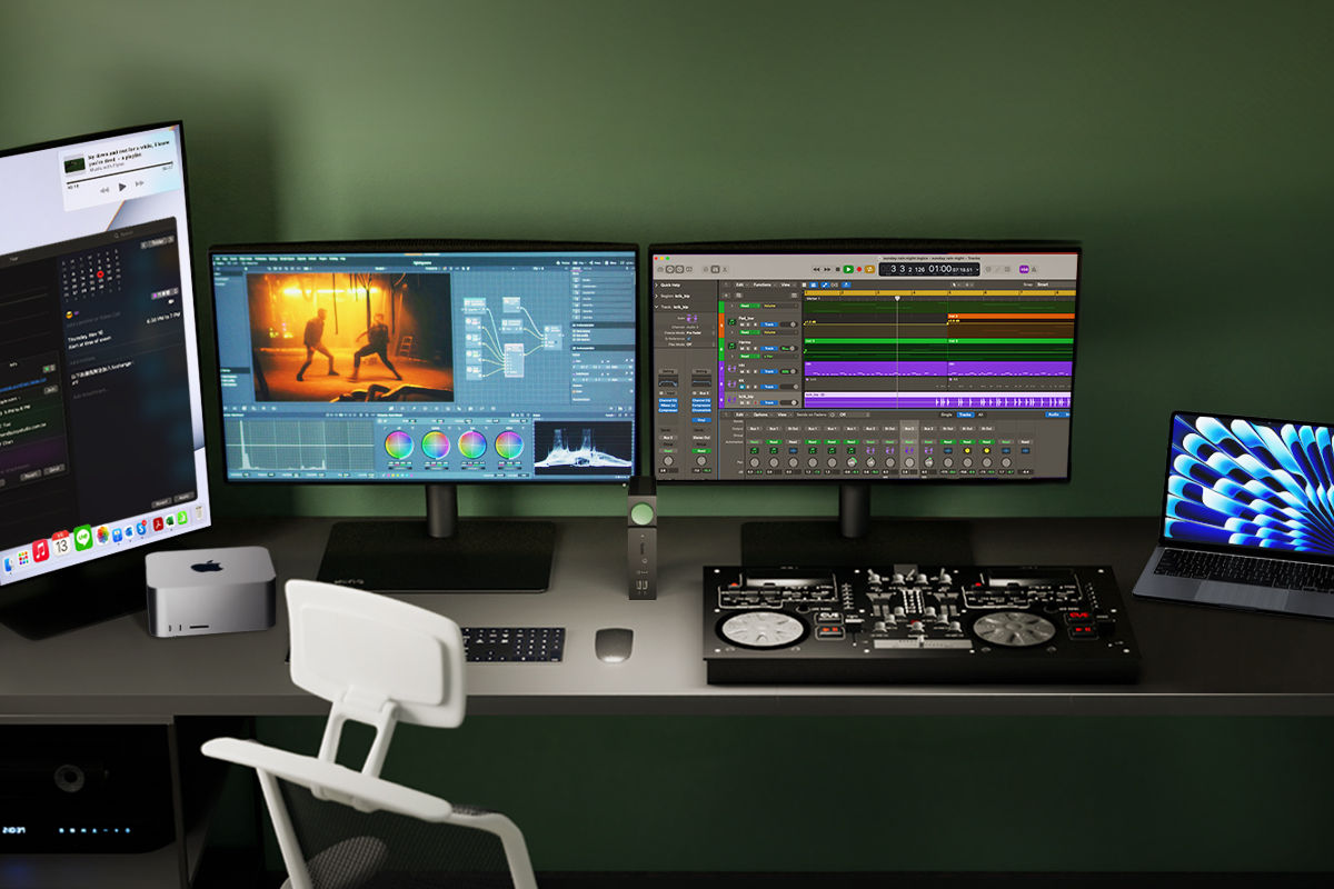 A perfect desk setup merging a Mac mini and MacBook, extended to two screens via the DP1310, each displaying different workspaces: one for image processing and the other for document handling. The DP1310 also connects to a hard drive and an editing console, providing power to both.