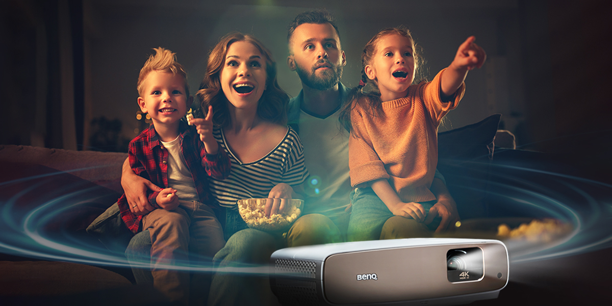 The family is enjoying movie with projector that comes with powerful and advanced built-in speakers which offer excellent sound performance.