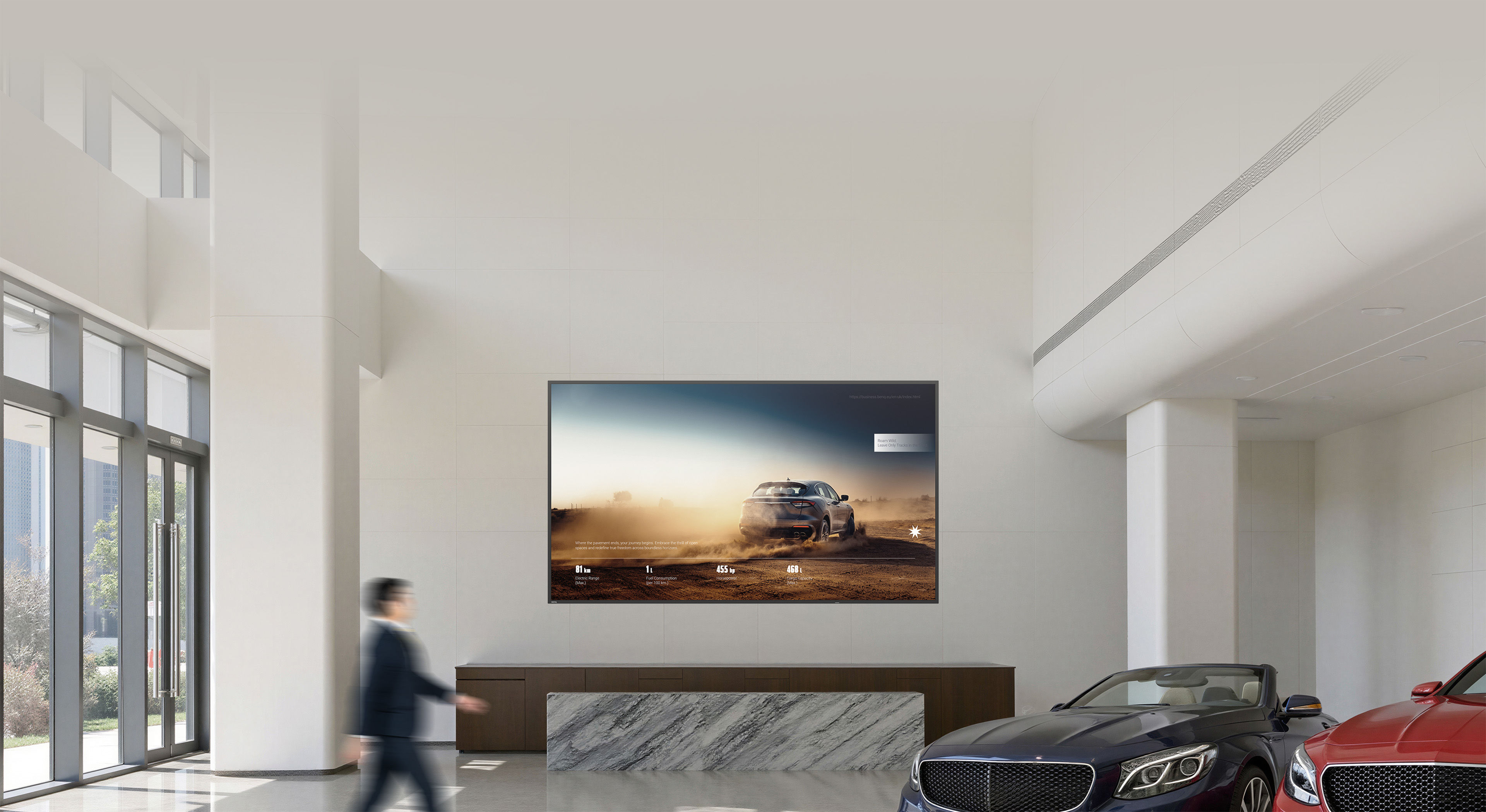 A gray car and a red sports car displayed with perfect color accuracy on BenQ digital signage, highlighting how Pantone Validated technology reproductions exactly match brand definitions on a commercial digital signage display.