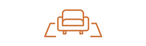 Illustration of a couch facing a fixed wall-mounted screen, showing inflexible viewing positions in traditional home theater setups