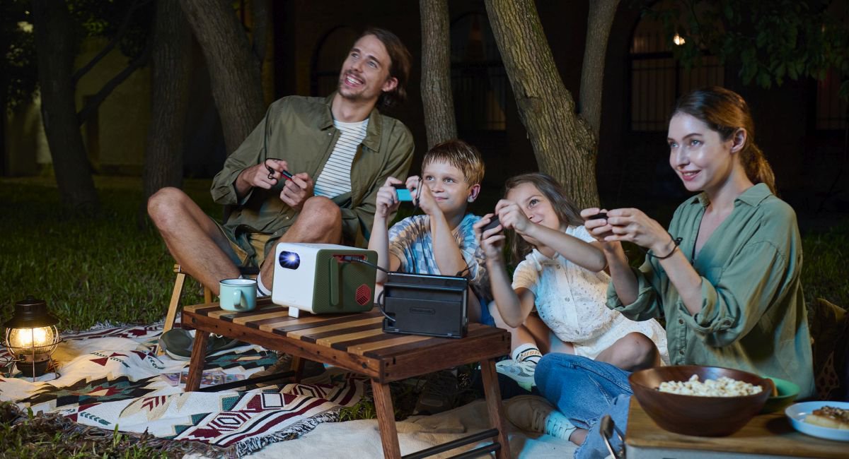 A family playing video games using portable projector 