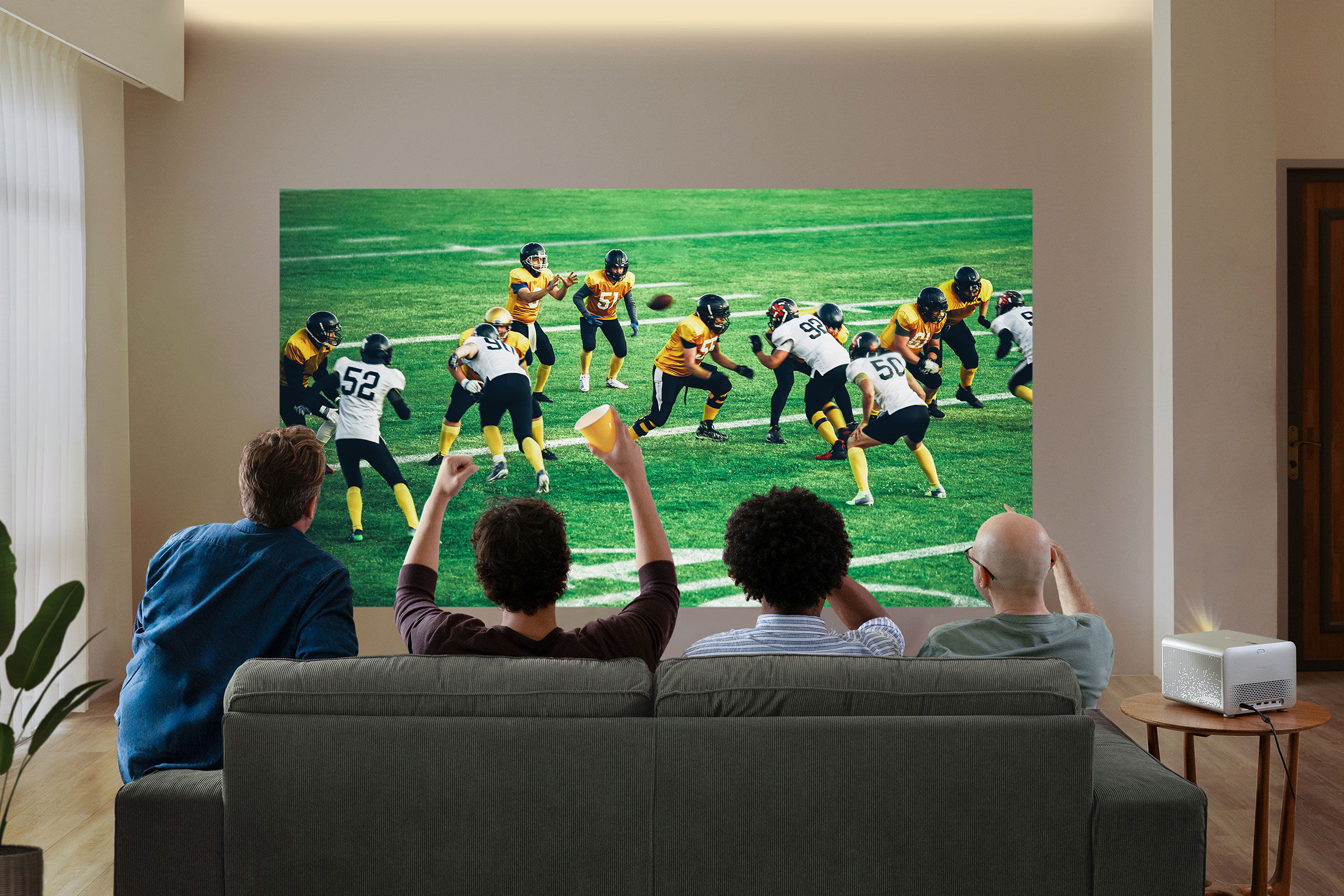 Hosting a football watch party at home for Super Bowl or NFL? Discover how a 150-inch+ setup delivers immersive 4K visuals, wireless sound, and post-game fun with BenQ Home Entertainment Projectors.