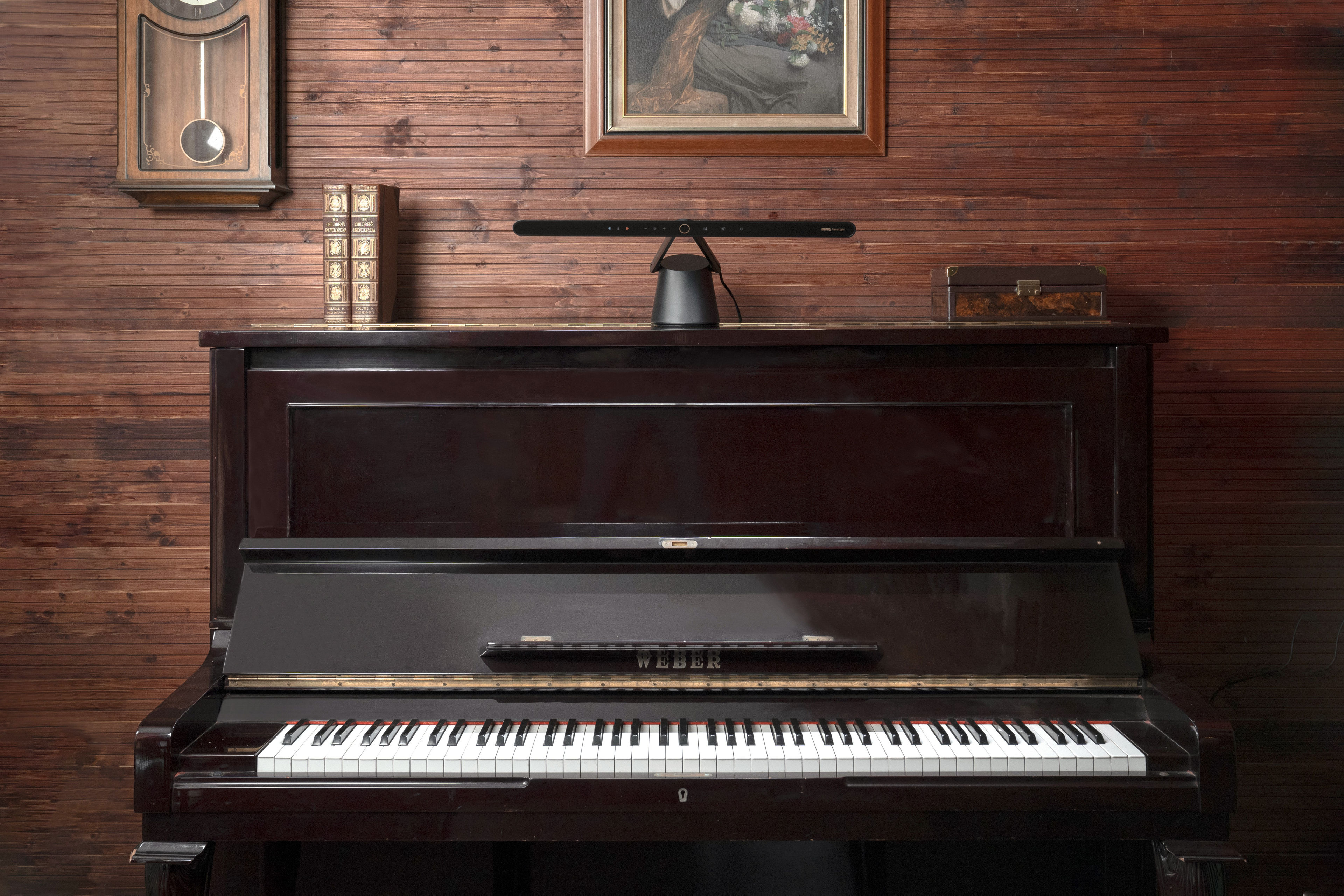 a black modern piano lamp placing in a classical and elegant room