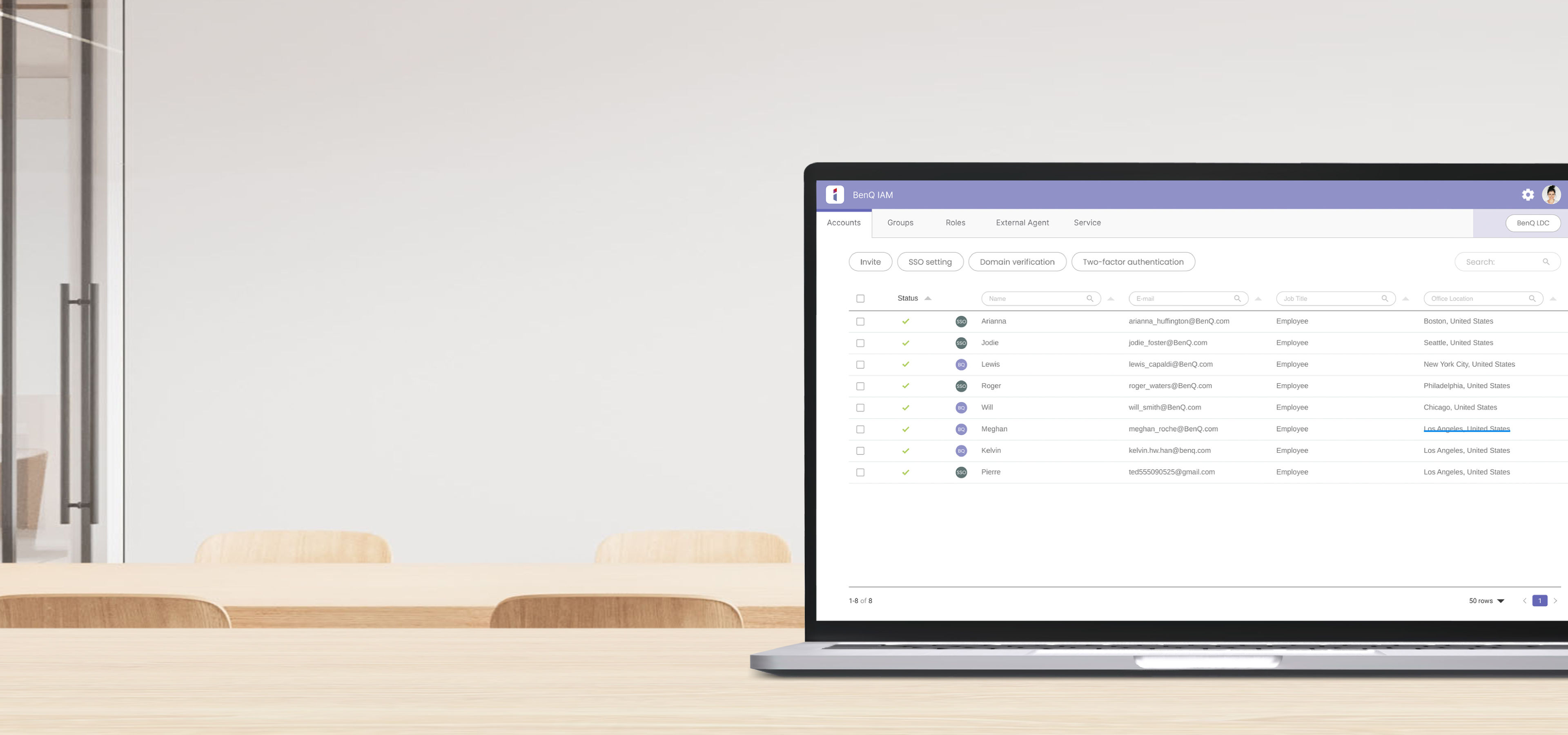 A laptop displaying the BenQ IAM centralized console, showing a managed list of user accounts with browser-based remote control for secure device access.