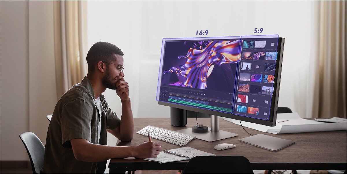 The designer is designing on an ultrawide monitor with the split screen technology.