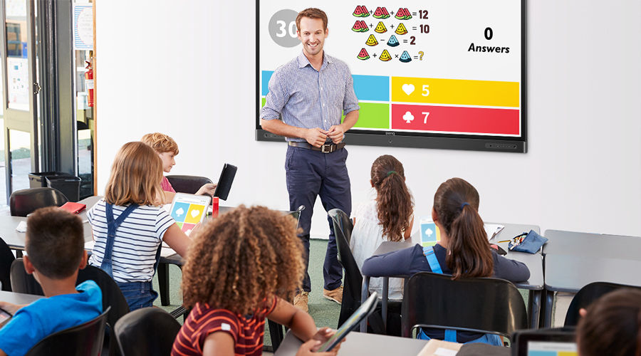 class of elementary school students playing a math Kahoot! quiz on BenQ interactive display