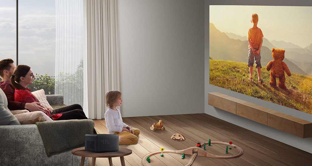 Open-plan living room with natural light, featuring the BenQ GP520 projector with Auto Cinema Mode delivering a large-screen home entertainment experience