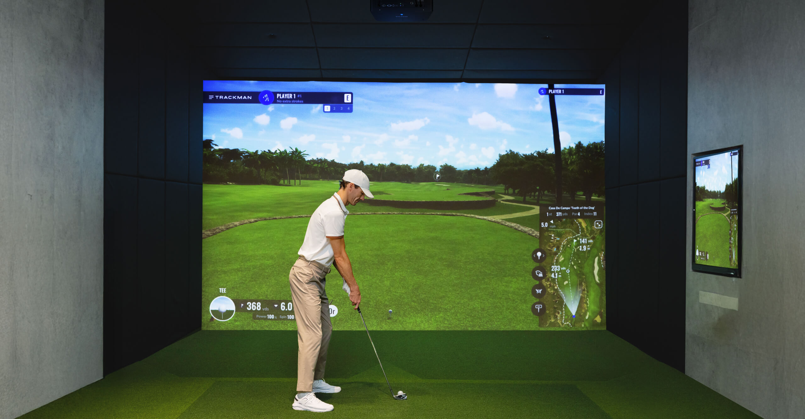 BenQ LK936ST swinging in DIY garage basement living room golf simulator with BenQ 4K short throw projector