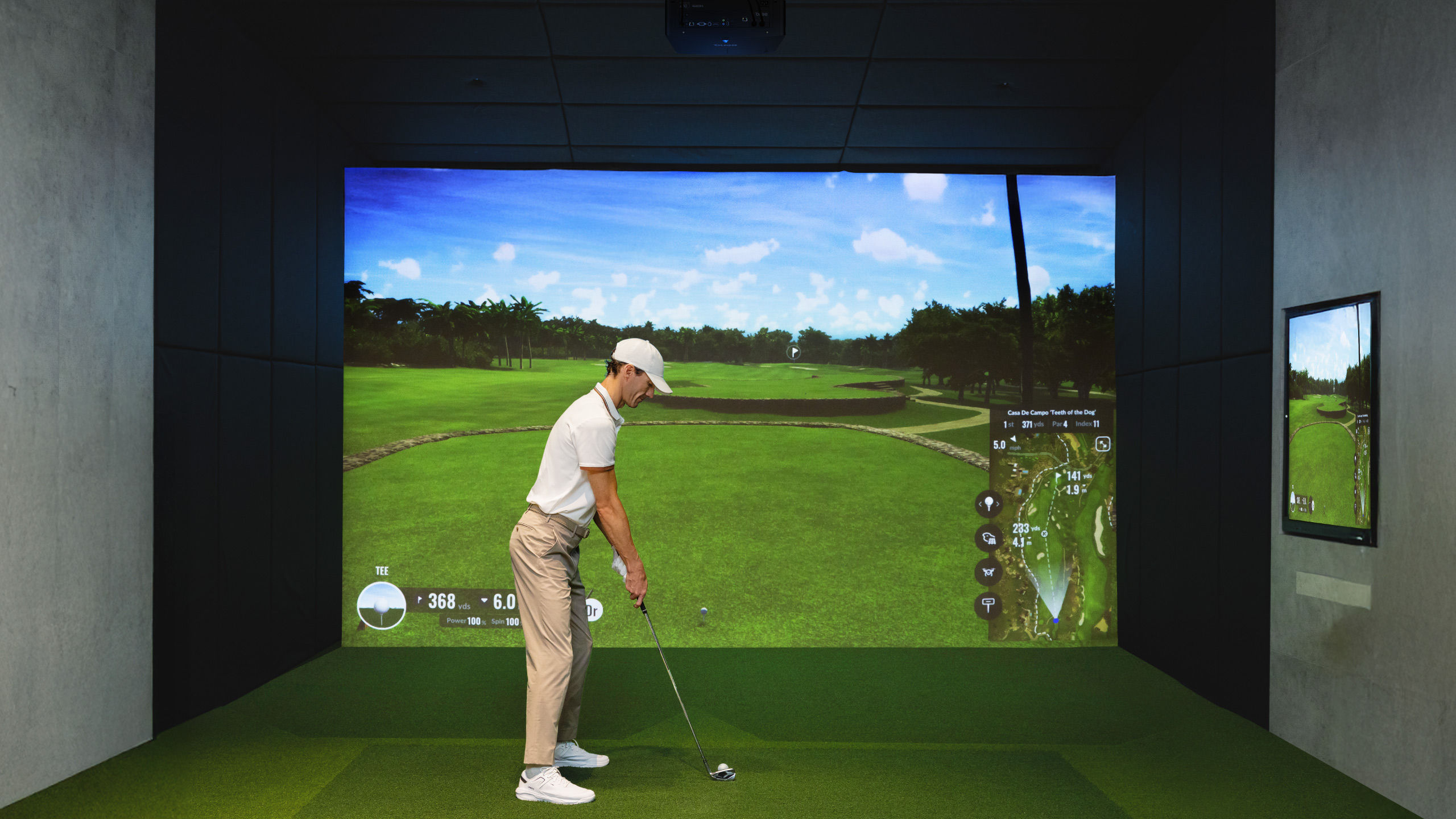 BenQ LK936ST swinging in DIY garage basement living room golf simulator with BenQ 4K short throw projector