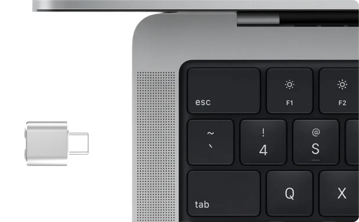 Compact USB-C mouse receiver shown next to a MacBook USB-C port for a clean, adapter-free setup.