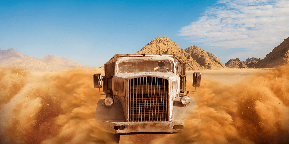 A oil truck is running in the desert like a movie scene in Mad Max Fury Road.