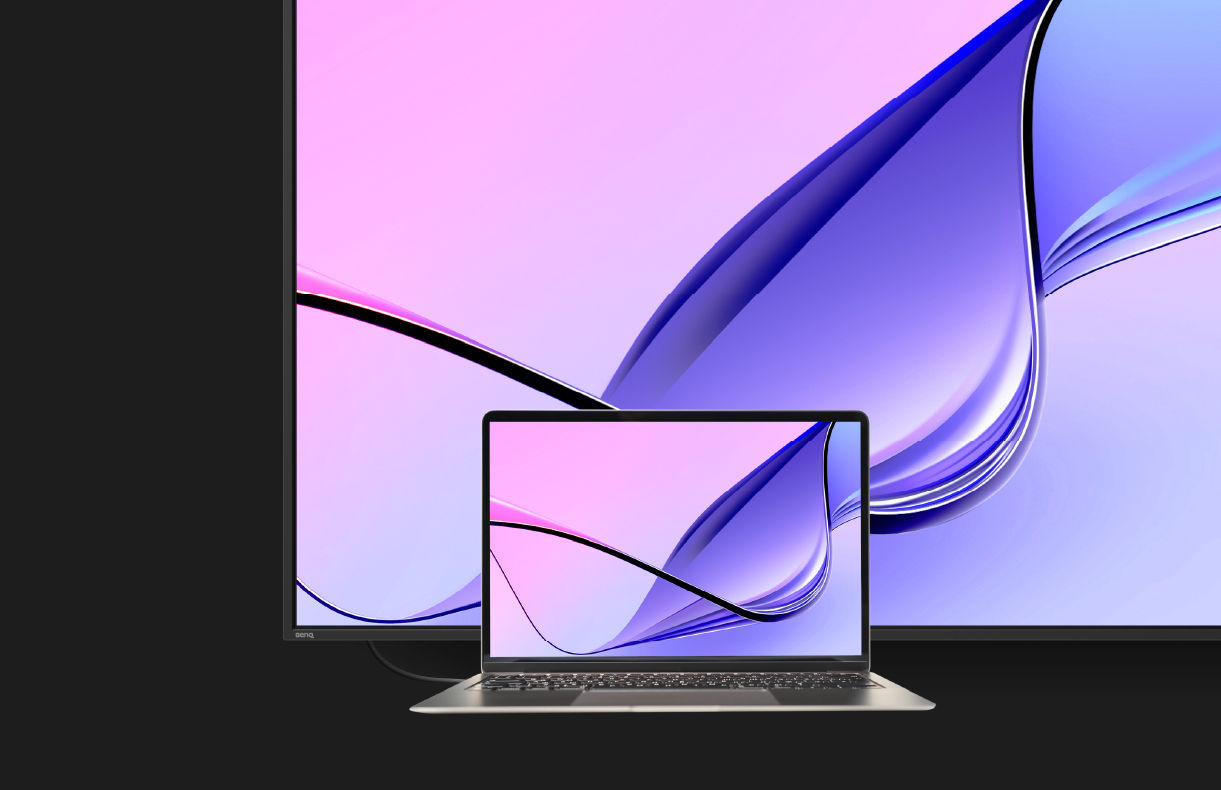 A MacBook laptop screen mirrored perfectly on a vibrant BenQ digital signage display in M-book mode, showcasing consistent color reproduction for professional workplace solutions.