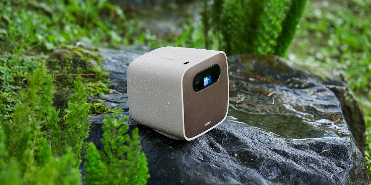 a mini portable projector used in the wild with water splash proof