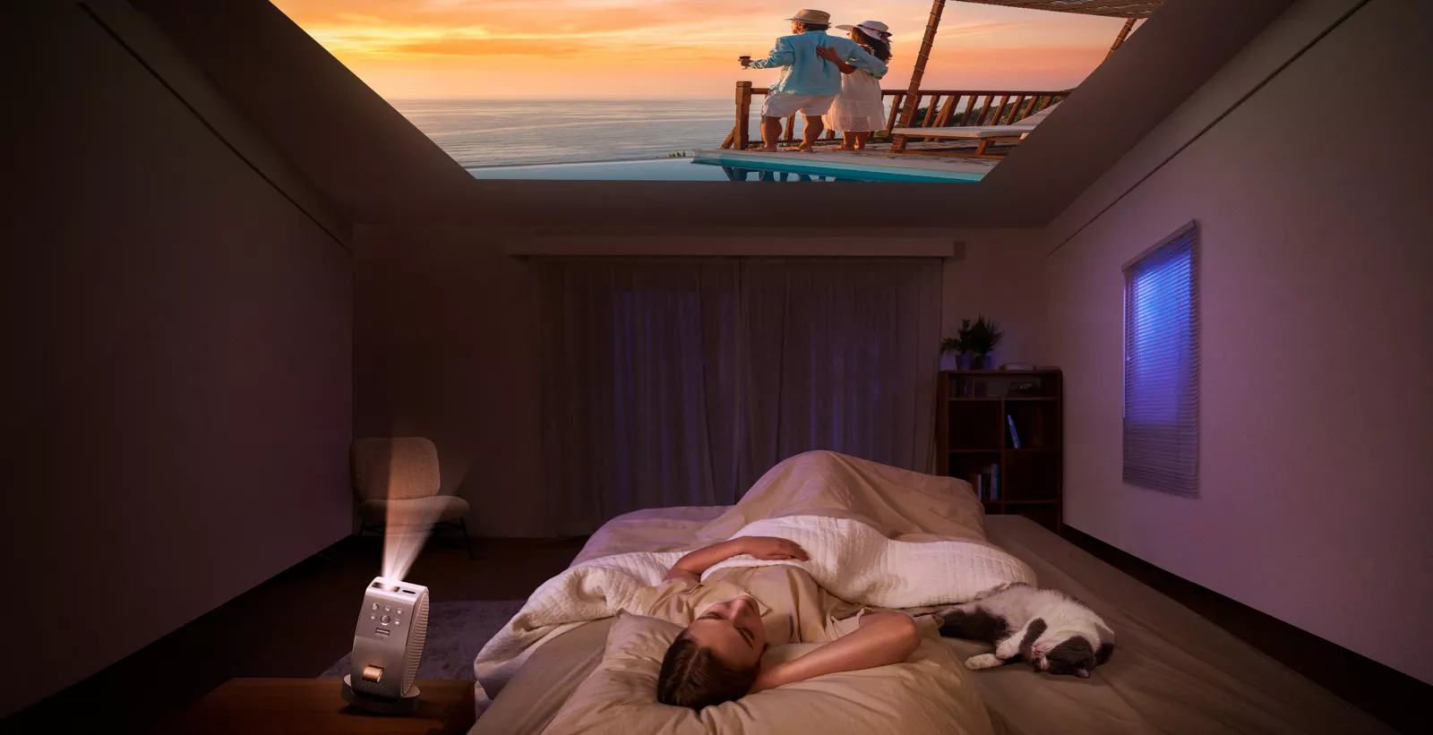 BenQ GV50 projecting a movie onto a bedroom ceiling
