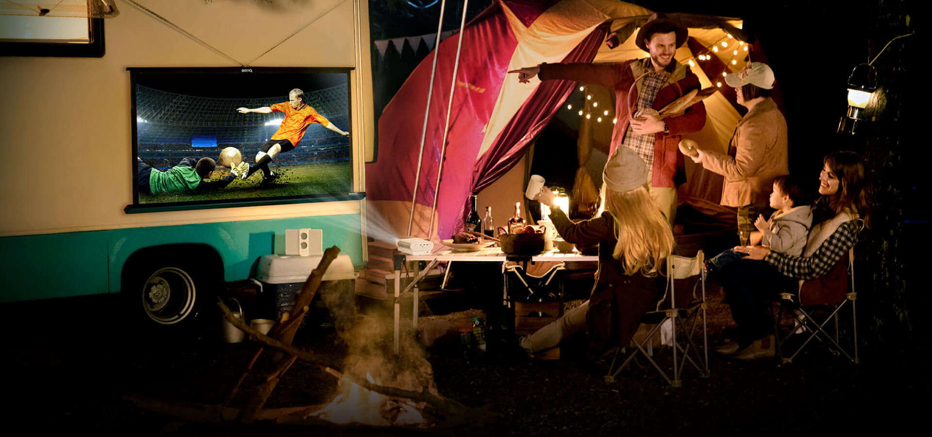 Family uses portable projector during a camping trip