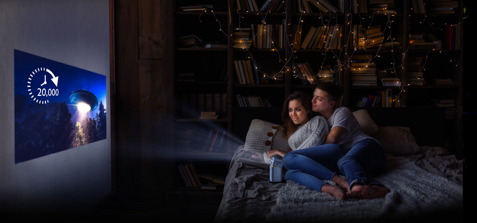 The couple is watching the movie through the portable projector. 