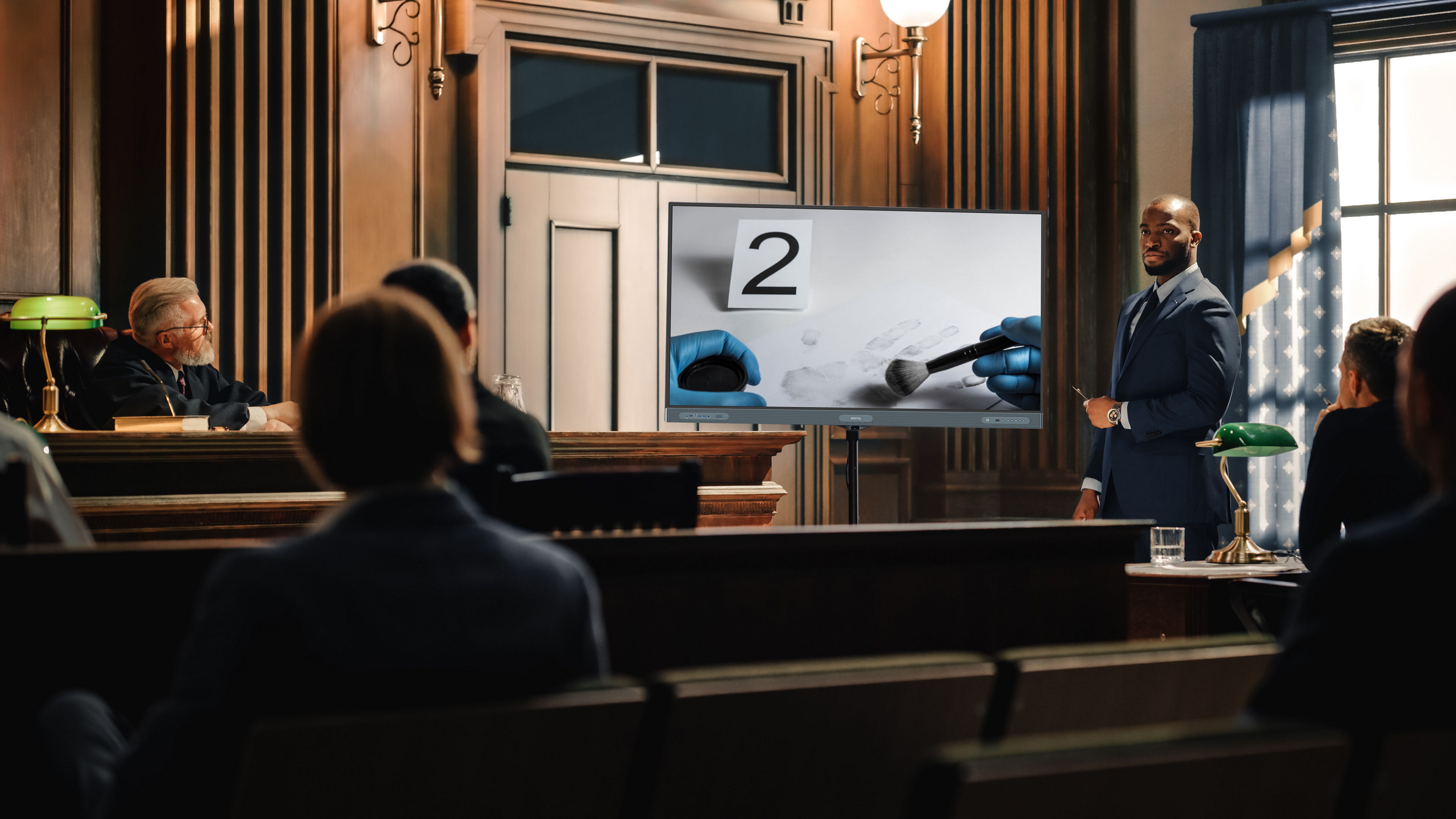 Court of Law Trial in Session: Portrait of Charismatic Male Public Defender Showing Analysis of Financal Crime on TV Screen to Judge and Jury. Attorney Lawyer Protecting Client, Presenting Case.