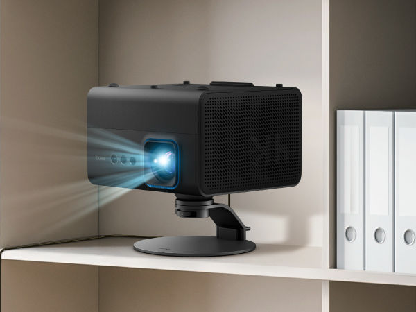 BenQ projector positioned on high bookshelf using adjustable stand for elevated projection in small spaces